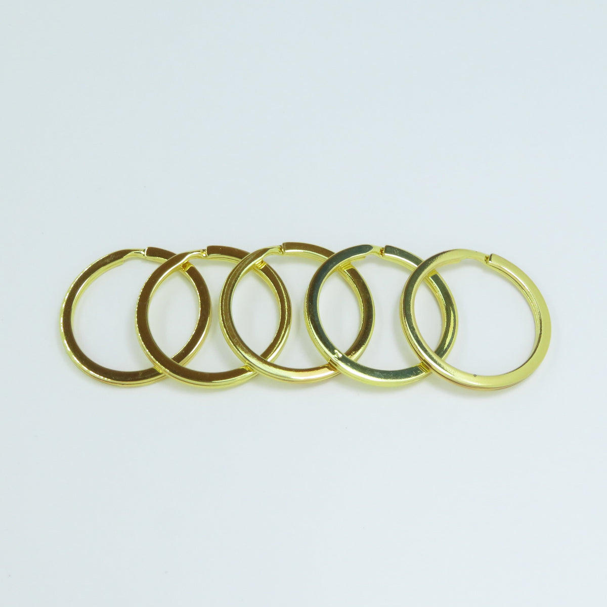 Brass-finish-jump-rings-flat-split-rings-keychain-attachment-keyring-making-blanks.png